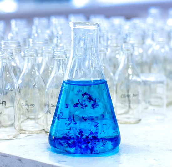 iStock-1276416824 lab technician extracting samples from test tubes