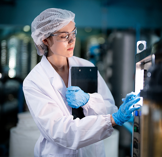 iStock-1756895645 lab technician extracting samples from test tubes